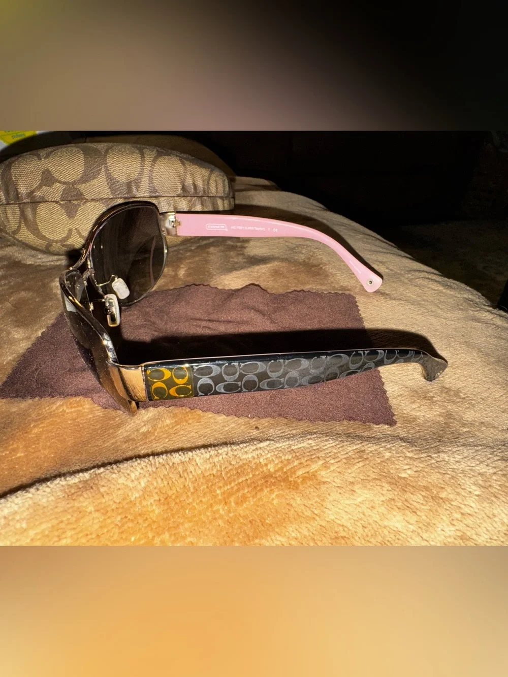 Coach aviator sunglasses with brown lenses and pink temples